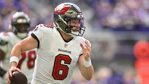 Sep 10, 2023; Minneapolis, Minnesota, USA; Tampa Bay Buccaneers quarterback Baker Mayfield (6) rolls out during the second quarter against the Minnesota Vikings at U.S. Bank Stadium. Mandatory Credit: Jeffrey Becker-USA TODAY Sports