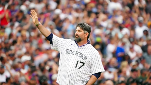 Jul 13, 2021; Denver, Colorado, USA; Colorado Rockies former player Todd Helton throws out the ceremonial first pitch prior to the 2021 MLB All Star Game at Coors Field.