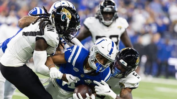 Sep 10, 2023; Indianapolis, Indiana, USA; Indianapolis Colts wide receiver Josh Downs (1) catches the ball while Jacksonville Jaguars safety Andre Cisco (5) defends in the first quarter at Lucas Oil Stadium. Mandatory Credit: Trevor Ruszkowski-USA TODAY Sports