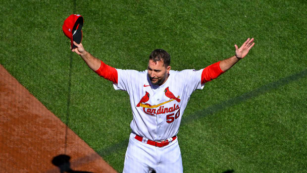 Mar 30, 2023; St. Louis, Missouri, USA; St. Louis Cardinals pitcher Adam Wainwright (50) salutes the fans before an opening day game against the Toronto Blue Jays at Busch Stadium.