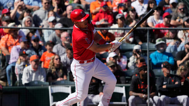 Los Angeles Angels center fielder Mike Trout hits a single against the SF Giants in the first inning at Tempe Diablo Stadium. (2023)