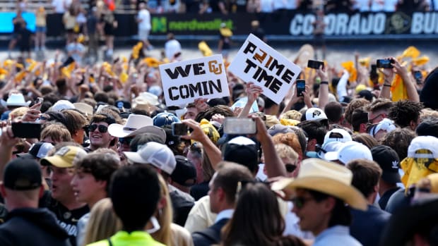 Colorado Buffaloes fans celebrate the win over the against the Nebraska Cornhuskers at Folsom Field