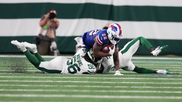 Jets' LB Quincy Williams tackles Bills' RB Damien Harris