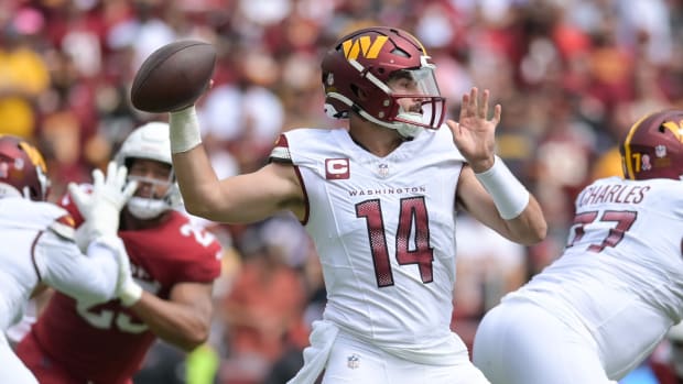 Washington Commanders quarterback Sam Howell (14) throws from the pocket during the second quarter against the Arizona Cardinals at FedExField.