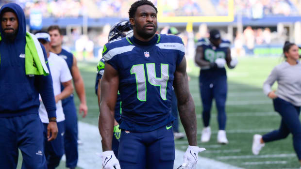 Sep 10, 2023; Seattle, Washington, USA; Seattle Seahawks wide receiver DK Metcalf (14) walks off the field during halftime against the Los Angeles Rams at Lumen Field. Mandatory Credit: Steven Bisig-USA TODAY Sports  