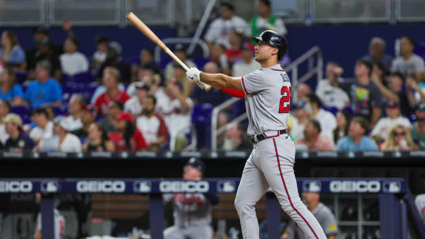Sep 16, 2023; Miami, Florida, USA; Atlanta Braves first baseman Matt Olson (28) hits a home run against the Miami Marlins during the sixth inning at loanDepot Park.