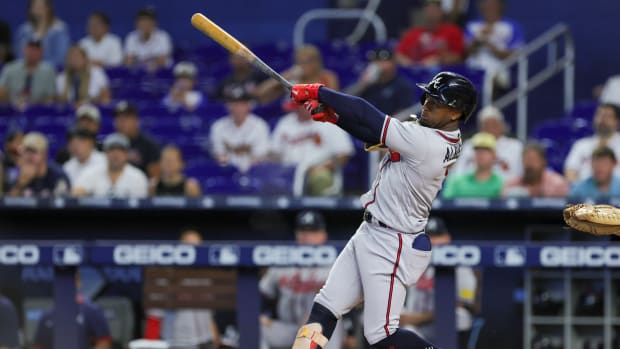 Sep 16, 2023; Miami, Florida, USA; Atlanta Braves second baseman Ozzie Albies (1) hits a two-run home run against the Miami Marlins during the first inning at loanDepot Park.