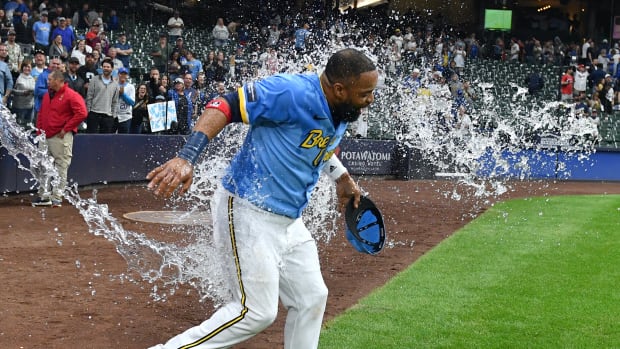 Sep 15, 2023; Milwaukee, Wisconsin, USA; Milwaukee Brewers first baseman Carlos Santana (41) gets doused by Milwaukee Brewers shortstop William Adames (27) after hitting two home runs against the Washington Nationals at American Family Field.
