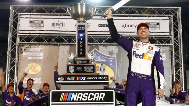 Denny Hamlin celebrates in victory lane after winning Saturday's NASCAR Cup Series Bass Pro Shops Night Race at Bristol Motor Speedway. (Photo by Jared C. Tilton/Getty Images)