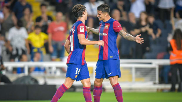 Joao Felix (left) and Joao Cancelo pictured celebrating during Barcelona's 5-0 win over Real Betis in September 2023