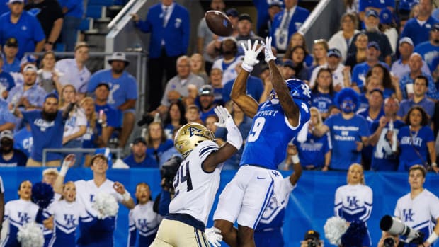 Sep 16, 2023; Lexington, Kentucky, USA; Kentucky Wildcats wide receiver Tayvion Robinson (9) catches a pass in the end zone for a touchdown during the second quarter against the Akron Zips at Kroger Field. Mandatory Credit: Jordan Prather-USA TODAY Sports