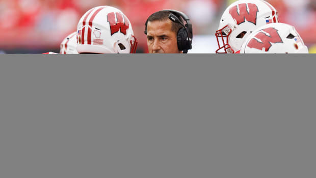 Sep 16, 2023; Madison, Wisconsin, USA; Wisconsin Badgers head coach Luke Fickell talks with linebacker Marty Strey (32) during the second quarter against the Georgia Southern Eagles at Camp Randall Stadium. Mandatory Credit: Jeff Hanisch-USA TODAY Sports