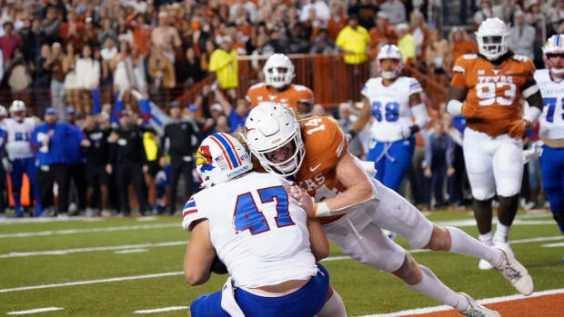 Nov 13, 2021; Austin, Texas, USA; Kansas Jayhawks fullback Jared Casey (47) catches a pass for the game winning two point conversion while being defended by Texas Longhorns defensive back Brenden Schooler (14) in overtime at Darrell K Royal-Texas Memorial Stadium. Mandatory Credit: Scott Wachter-USA TODAY Sports  