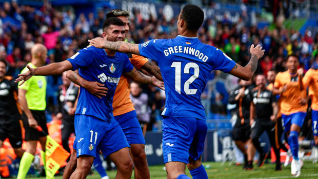 Mason Greenwood pictured celebrating with his Getafe teammates during a 3-2 win over Osasuna on his La Liga debut in September 2023