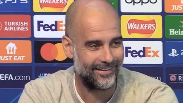 Manchester City manager Pep Guardiola pictured laughing during a press conference in September 2023