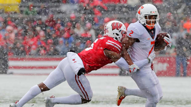Illinois Fighting Illini running back Reggie Corbin (2) is tackled by Wisconsin Badgers cornerback Rachad Wildgoose (5) in the second quarter of a Big Ten conference football game at Camp Randall Stadium on Saturday, October 20, 2018 in Madison, Wis. Adam Wesley/USA TODAY NETWORK-Wis Gpg Badgersvsillinois 102018 Abw776