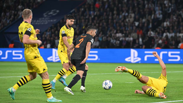 Achraf Hakimi pictured (center) moments before scoring for PSG against Borussia Dortmund in September 2023