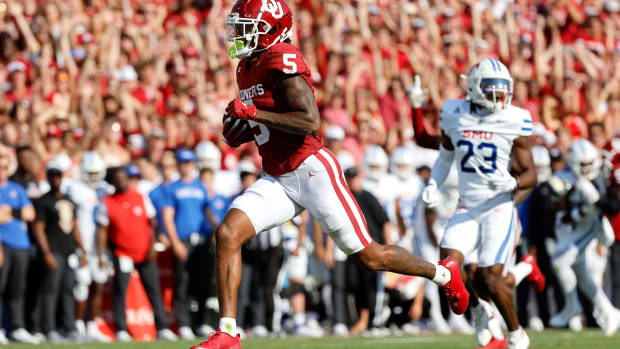 Oklahoma's Andrel Anthony (5) runs in for a touchdown in front of SMU's Isaiah Nwokobia (23) in the first half of the college football game between the University of Oklahoma Sooners and the Southern Methodist University Mustangs at the Gaylord Family Oklahoma Memorial Stadium in Norman, Okla., Saturday, Sept. 9, 2023.  
