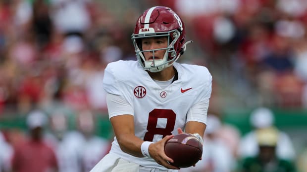 Sep 16, 2023; Tampa, Florida, USA; Alabama Crimson Tide quarterback Tyler Buchner (8) looks to hand off against the South Florida Bulls in the first quarter at Raymond James Stadium. Mandatory Credit: Nathan Ray Seebeck-USA TODAY Sports