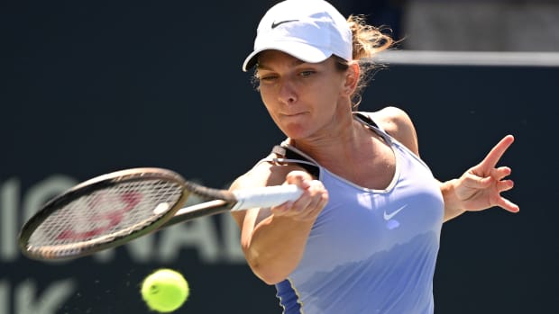 Simona Halep plays a shot against Jil Teichmann.