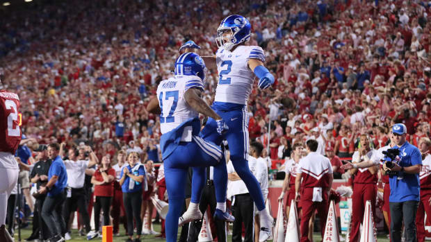 Sep 16, 2023; Fayetteville, Arkansas, USA; BYU Cougars wide receiver Chase Roberts (2) celebrates with wide receiver Keelan Marion (17) after catching a pass for a touchdown in the fourth quarter against the Arkansas Razorbacks at Donald W. Reynolds Razorback Stadium. BYU won 38-31.