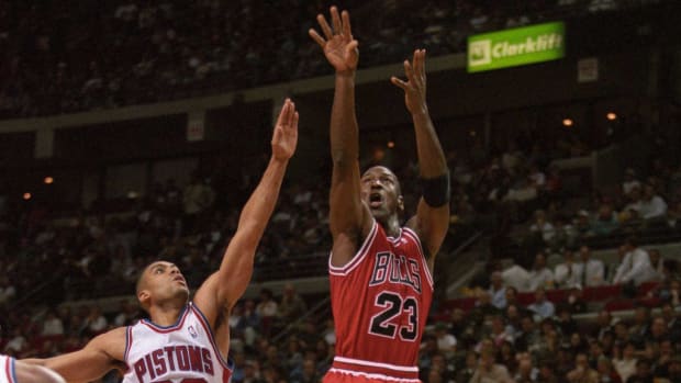 Chicago Bulls guard Michael Jordan (23) shoots against the Detroit Pistons at the Palace at Auburn Hills