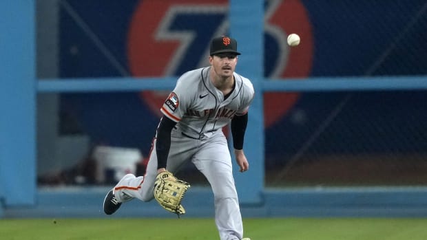 SF Giants right fielder Mike Yastrzemski attempts to catch a fly ball single by Los Angeles Dodgers shortstop Miguel Rojas (not pictured) in the third inning at Dodger Stadium on September 22, 2023.