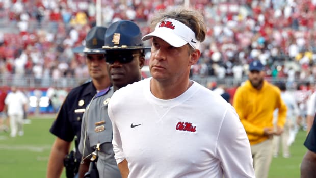 Mississippi Rebels head coach Lane Kiffin walks off the field after a 24-10 loss to the Alabama Crimson Tide at Bryant-Denny Stadium.