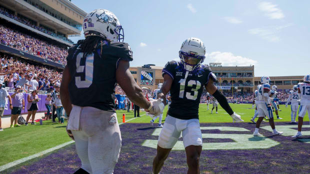 ep 23, 2023; Fort Worth, Texas, USA; TCU Horned Frogs running back Emani Bailey (9) and wide receiver Jaylon Robinson (13) celebrate after Bailey runs for a touchdown against the SMU Mustangs during the second half at Amon G. Carter Stadium. 