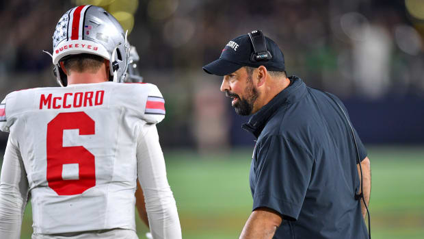 Ohio State Buckeyes head coach Ryan Day talks to quarterback Kyle McCord (6) in the second quarter against the Notre Dame Fighting Irish at Notre Dame Stadium. 