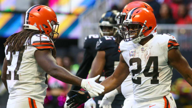 Browns running backs Kareem Hunt and Nick Chubb high five after a touchdown.