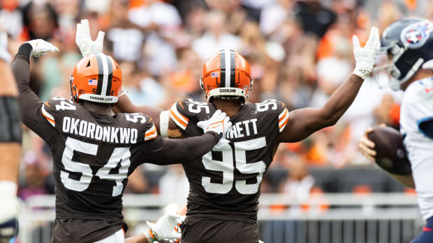 Sep 24, 2023; Cleveland, Ohio, USA; Cleveland Browns defensive end Ogbo Okoronkwo (54) and defensive end Myles Garrett (95) celebrate against the Tennessee Titans during the fourth quarter at Cleveland Browns Stadium. Mandatory Credit: Scott Galvin-USA TODAY Sports