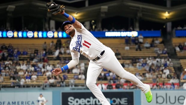 Dodgers third baseman Miguel Rojas makes a catch on a ball.