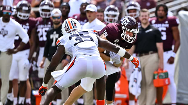 Sep 23, 2023; College Station, Texas, USA; Auburn Tigers linebacker Jalen McLeod (35) tackles Texas A&M Aggies tight end Jake Johnson (19) during the third quarter at Kyle Field. Mandatory