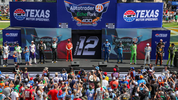 The NASCAR Cup Series Round of 12 playoff drivers pose onstage during driver intros prior to Sunday's NASCAR Cup Series Autotrader EchoPark Automotive 400 at Texas Motor Speedway. As it turned out afterward, four of those drivers now find themselves in trouble if they hope to advance to the next round. (Photo by Jonathan Bachman/Getty Images)