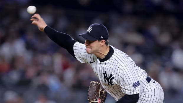 Sep 20, 2023; Bronx, New York, USA; New York Yankees relief pitcher Tommy Kahnle (41) pitches against the Toronto Blue Jays during the eighth inning at Yankee Stadium.