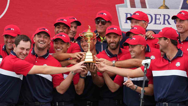 The 2020 U.S. Ryder Cup team poses with the Cup after winning at Whistling Straits.