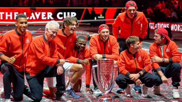 Team World poses with the 2022 Laver Cup trophy