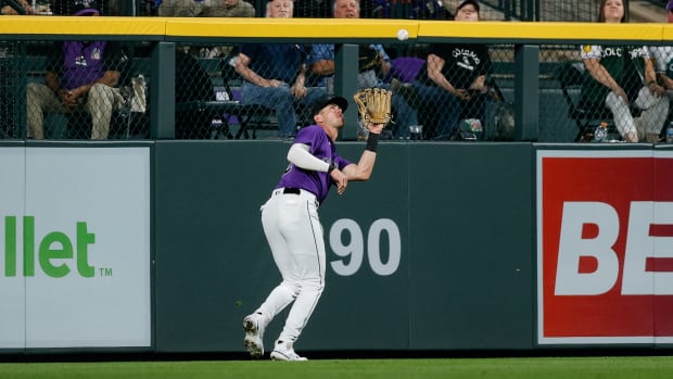 Sep 26, 2023; Denver, Colorado, USA; Colorado Rockies left fielder Nolan Jones (22) makes a catch for an out in the sixth inning against the Los Angeles Dodgers at Coors Field.