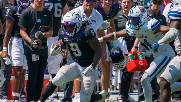 Sep 23, 2023; Fort Worth, Texas, USA; TCU Horned Frogs running back Emani Bailey (9) runs for a first down against the SMU Mustangs during the second half at Amon G. Carter Stadium. Mandatory Credit: Jerome Miron-USA TODAY Sports  