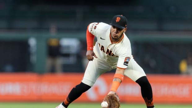 SF Giants second baseman Thairo Estrada (39) fields a ground ball for an out against the San Diego Padres during the first inning at Oracle Park.