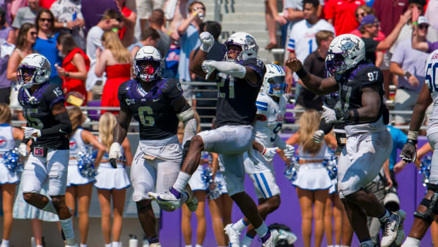 Sep 23, 2023; Fort Worth, Texas, USA; TCU Horned Frogs safety Bud Clark (21) and the Horned Frog defense celebrate after Clark intercepts an SMU Mustangs pass during the second half at Amon G. Carter Stadium. Mandatory Credit: Jerome Miron-USA TODAY Sports