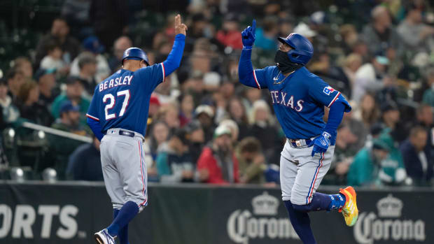 Sep 28, 2023; Seattle, Washington, USA; Texas Rangers right fielder Adolis Garcia (53) is congratulated by third base coach Tony Beasley after hitting a solo home run during the fourth inning against the Seattle Mariners at T-Mobile Park. Mandatory Credit: Stephen Brashear-USA TODAY Sports