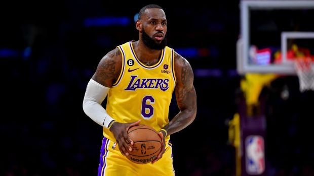 Lakers forward LeBron James holds the ball during a game.