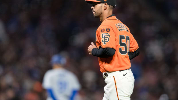 Sep 29, 2023; San Francisco, California, USA; San Francisco Giants interim manager Kai Correa (50) returns to the dugout after living starting pitcher Keaton Winn (67) during the sixth inning of the game against the Los Angeles Dodgers at Oracle Park.