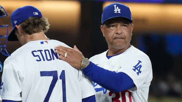 Dodgers manager Dave Roberts, right, removes pitcher Gavin Stone from a game