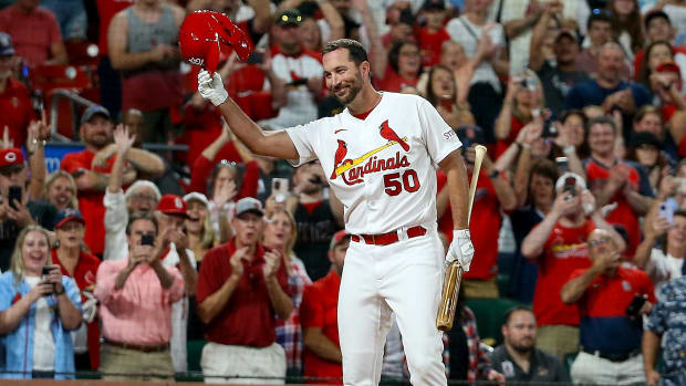 Cardinals pitcher Adam Wainwright tips his helmet to the home crowd ahead of his final at-bat.