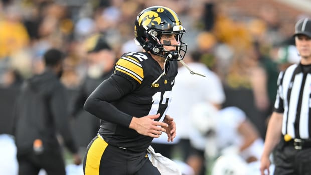 Iowa quarterback Cade McNamara warms up before the Hawkeyes' game against Michigan State on Sept. 30, 2023.