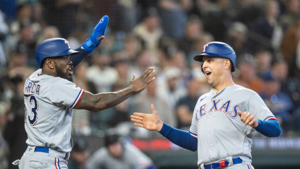 Sep 30, 2023; Seattle, Washington, USA; Texas Rangers third baseman Josh Jung (6) is congratulated by right fielder Adolis Garcia (53) after scoring a run against the Seattle Mariners during the third inning at T-Mobile Park. Mandatory Credit: Stephen Brashear-USA TODAY Sports