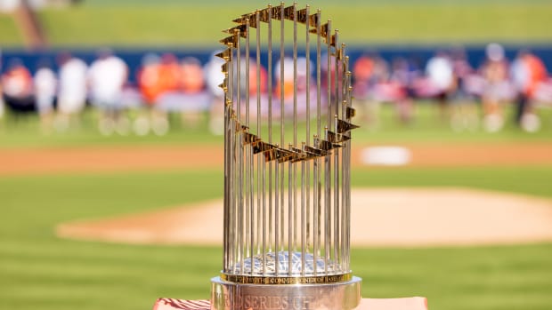 Feb 25, 2023; West Palm Beach, Florida, USA; The World Series trophy sits atop home plate prior to the game between the New York Mets and the Houston Astros at The Ballpark of the Palm Beaches.